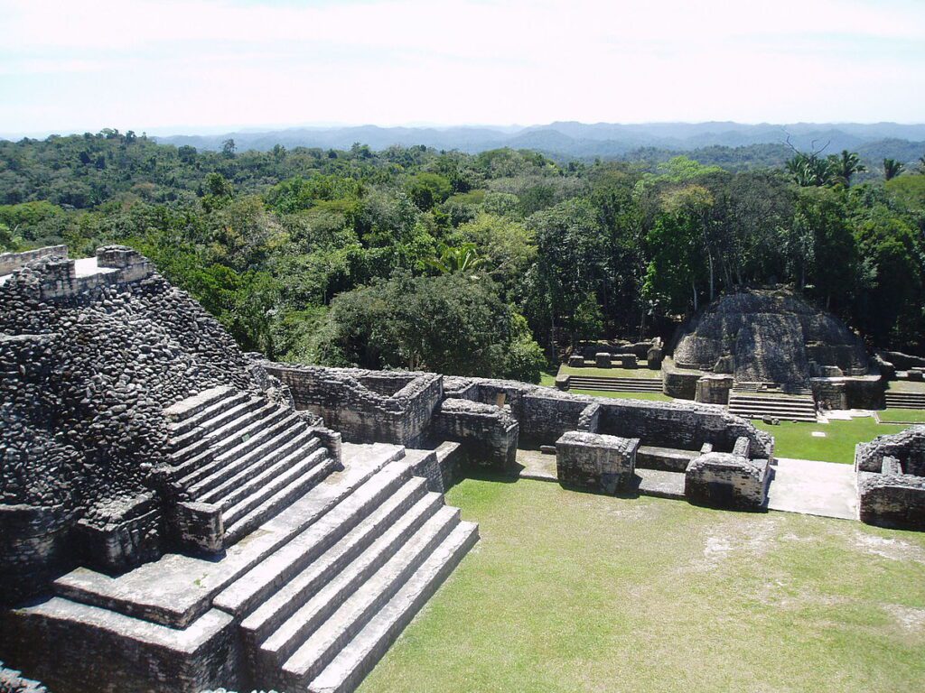 View across Caracol, Belize: familiar temple mounds in the foreground; LiDAR shows terraces and settlement belts extending far beyond this core.