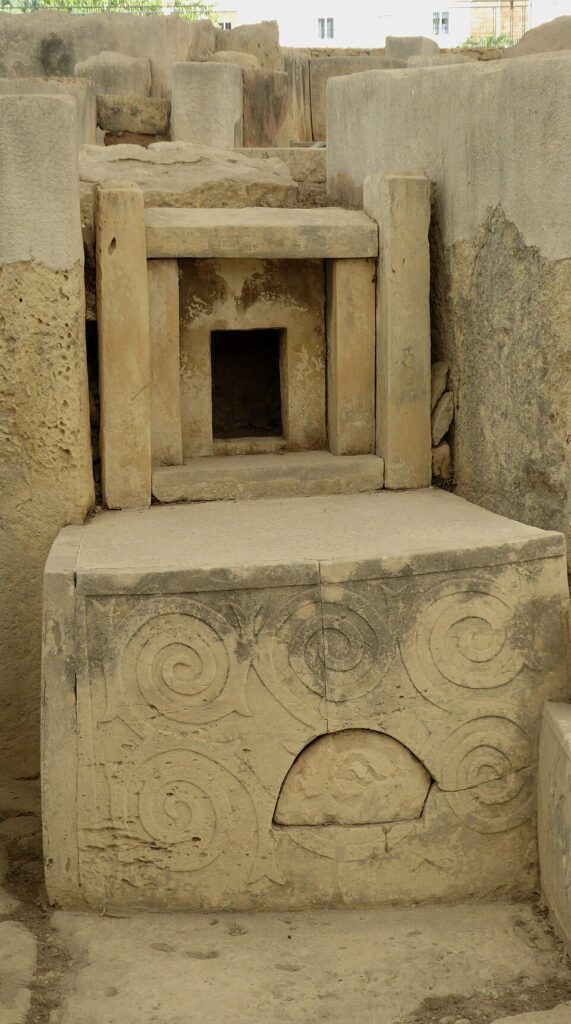 Decorated altar and slab at Tarxien, part of the same architectural tradition that manages sightlines and light.