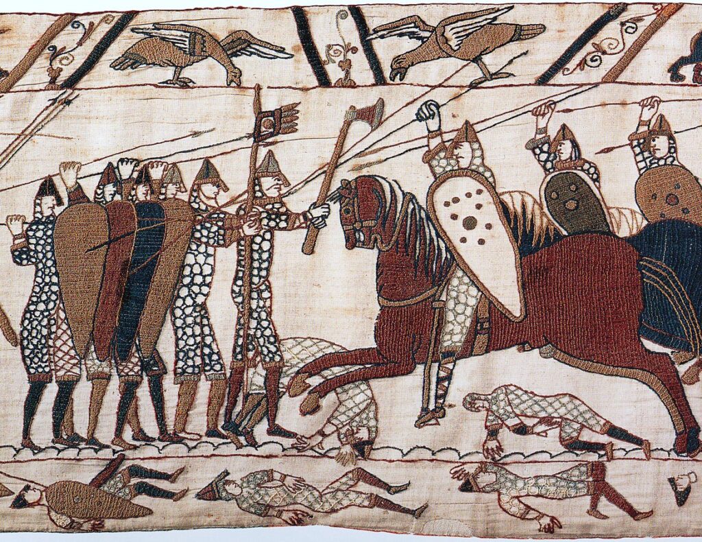 Bayeux Tapestry: Anglo-Saxon infantry form a tight shield wall against Norman cavalry, overlapping shields into a single defensive front.