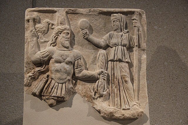 Roman relief showing Jupiter and Juno enthroned, with symbols of state and law