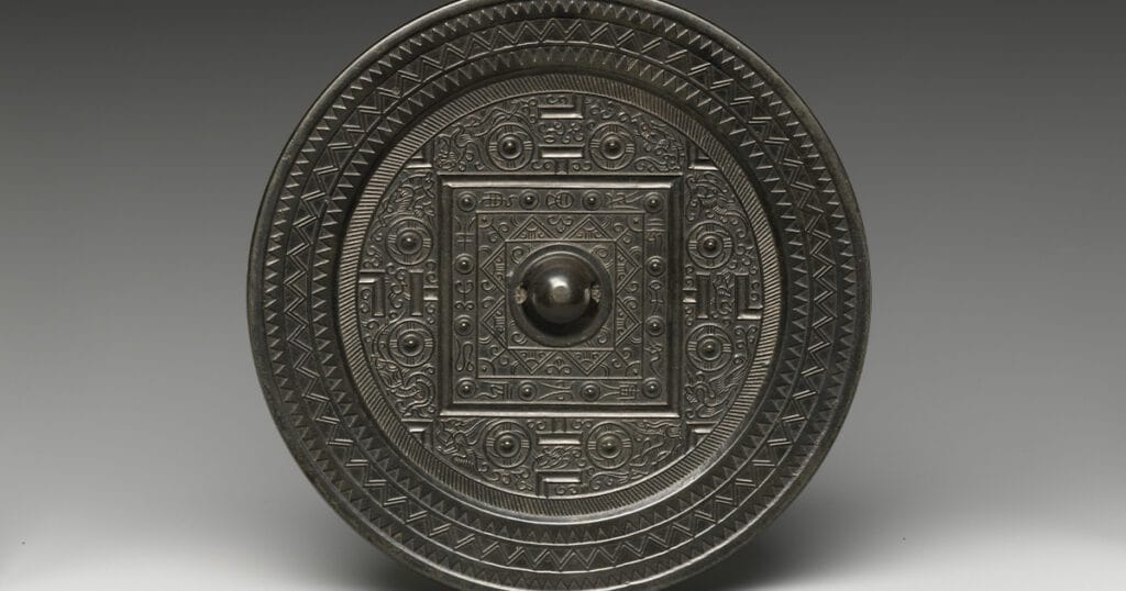 Han bronze mirror with square game-board layout and four beasts.
