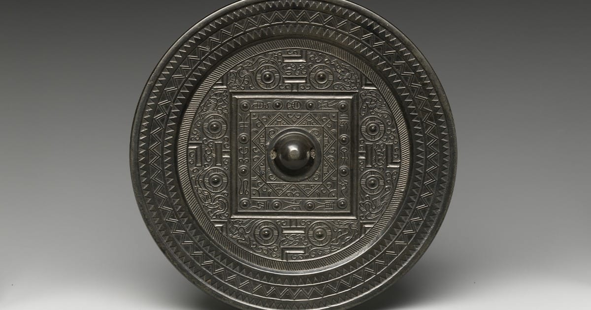Han bronze mirror with square game-board layout and four beasts.