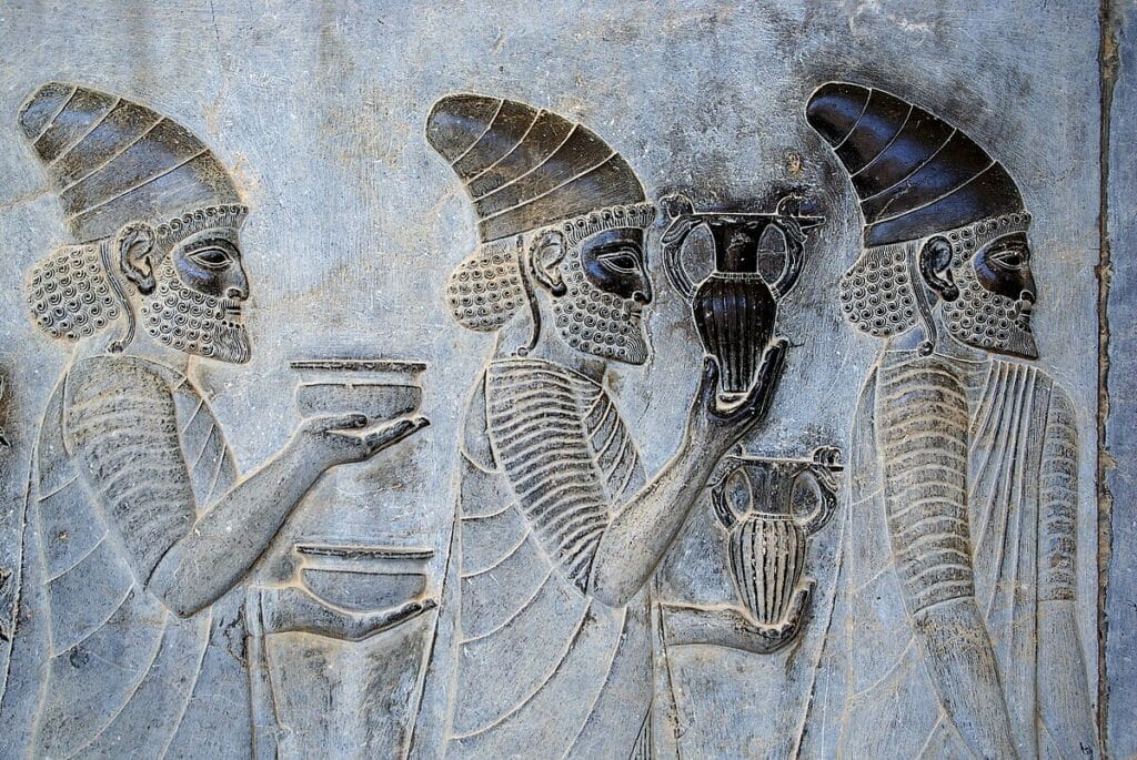 Persepolis terrace relief showing processional figures in calm profile.