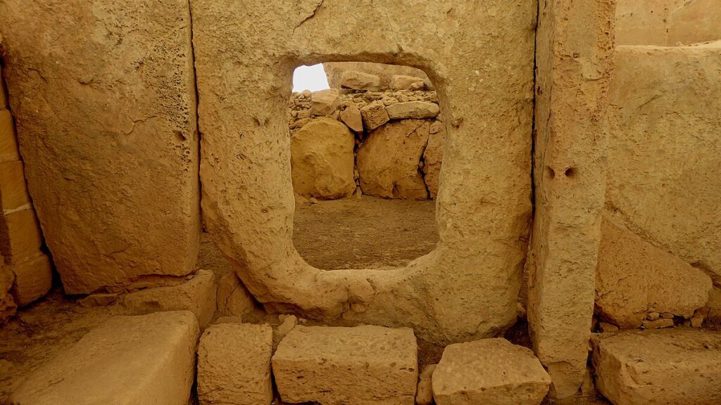 Hagar Qim interior porthole stone used to frame and admit controlled light into an apse.