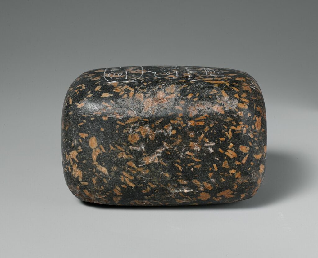 Large Egyptian weight marked for seventy debens, showing the scale of high-value official transactions.