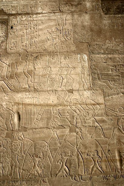 Relief from the Ramesseum showing the Siege of Dapur with Egyptian soldiers climbing scaling ladders under archery cover.