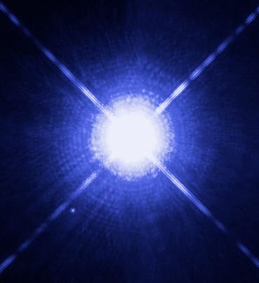 Hubble image showing bright Sirius A with faint white dwarf companion Sirius B